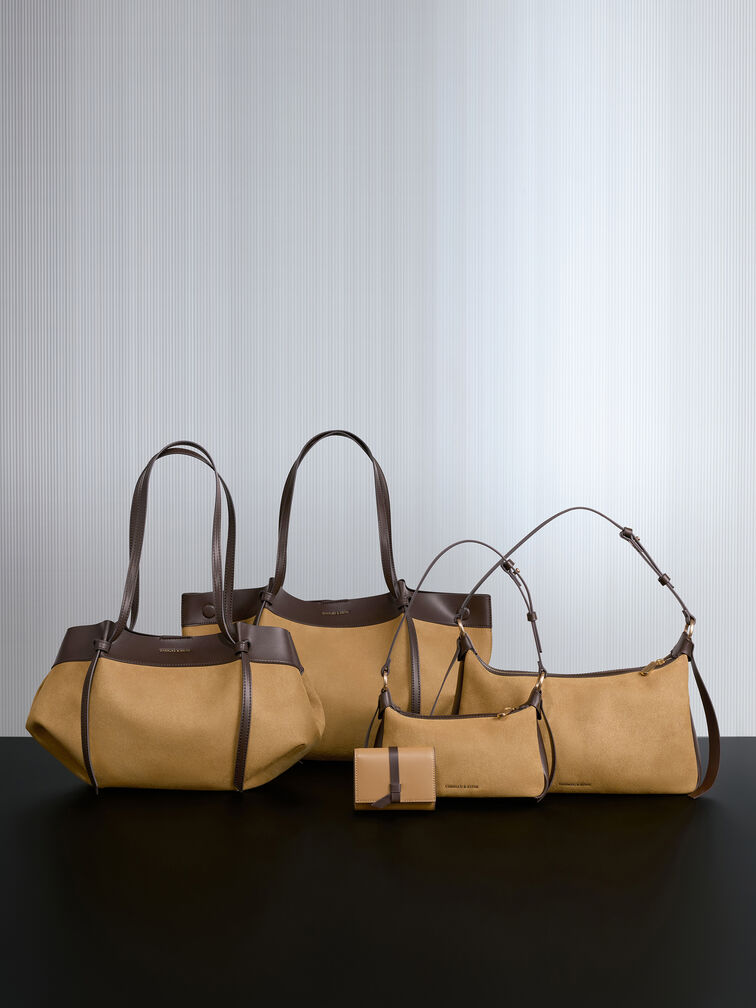 محفظة صغيرة كالا بتصميم ثنائي اللون وحمالة معقودة, رملي ذهبي هاديء, hi-res